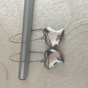 Sterling silver heart dangling earrings. 